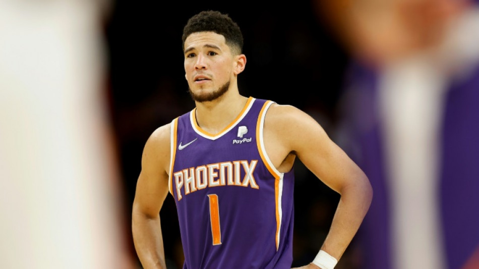 Booker stars as Suns beat Heat to seal NBA playoff berth