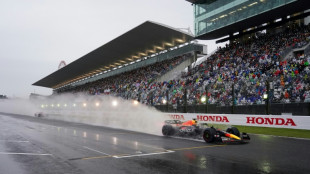 F1: le GP du Japon reprend sous la pluie après deux heures d'interruption