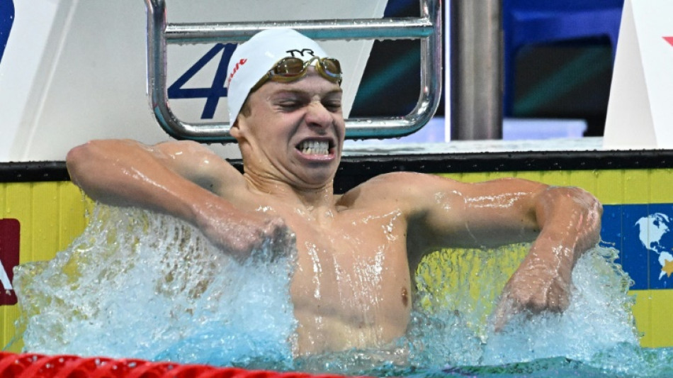 Born to medley, Marchand closes in on Phelps