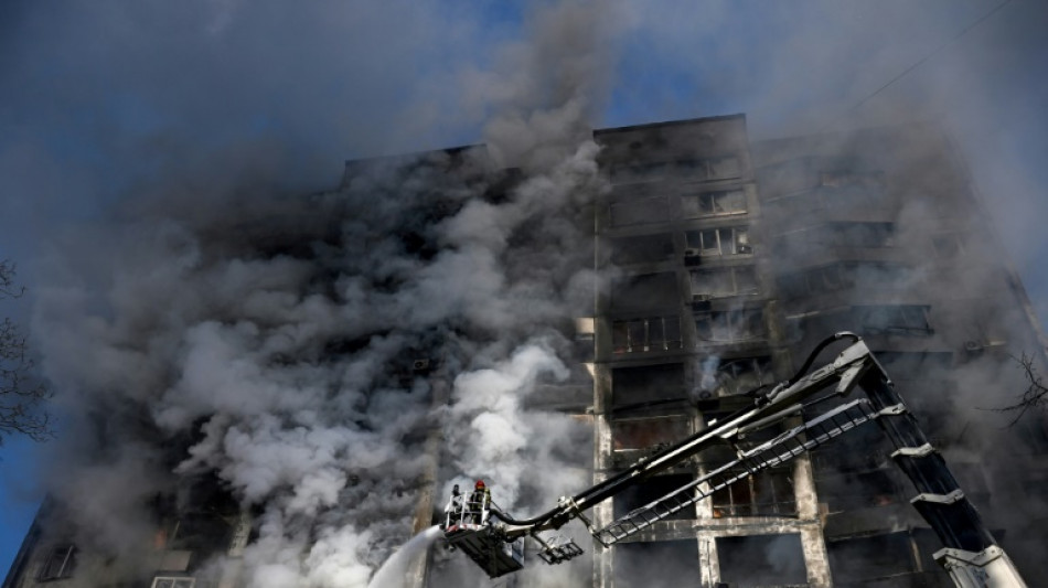 Russian forces press in on Kyiv as curfew begins