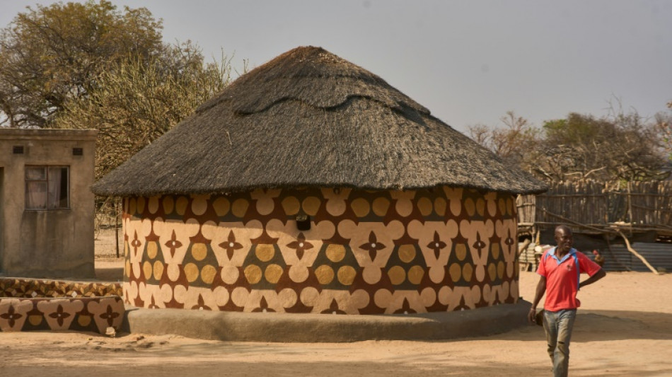 The women behind Zimbabwe's striking hut painting art
