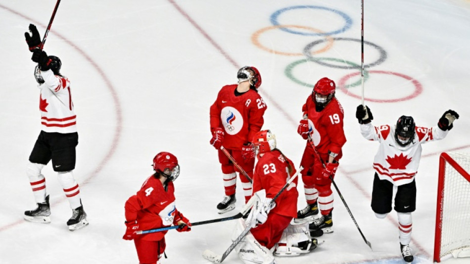 Olympic hockey players wear Covid face masks during match