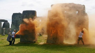 UK police arrest pair after Stonehenge sprayed with orange substance