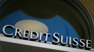 Scandal-plagued Credit Suisse warns profits to take hit