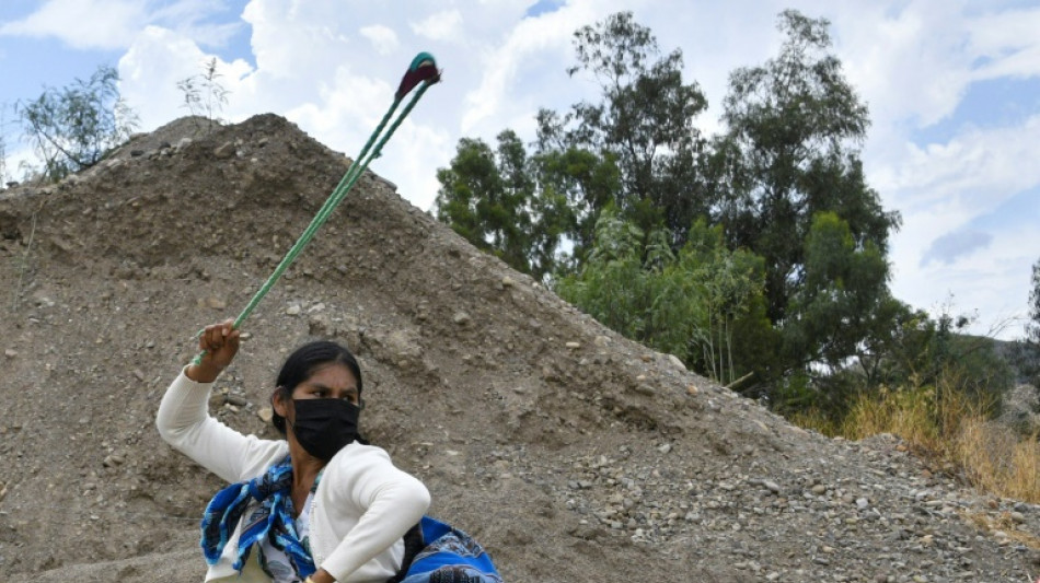 With stones and slings, supporters of Bolivia's Morales gird for battle